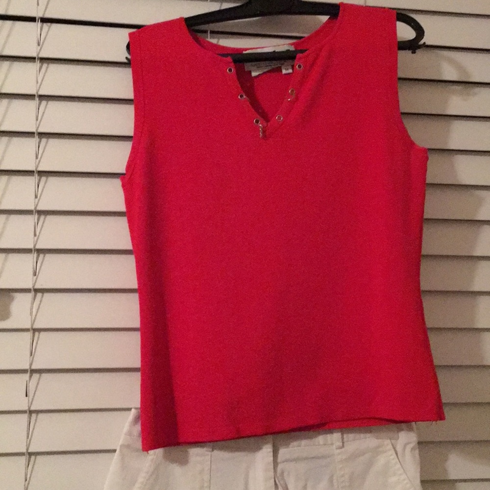 Red shirt with white cropped pants